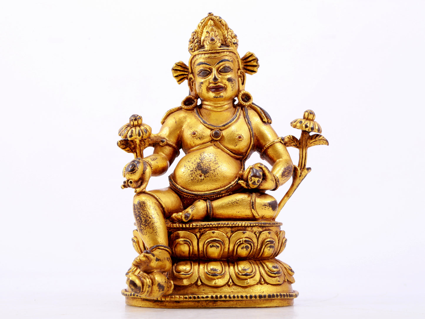 A solemn gilt bronze statue of the God of Wealth