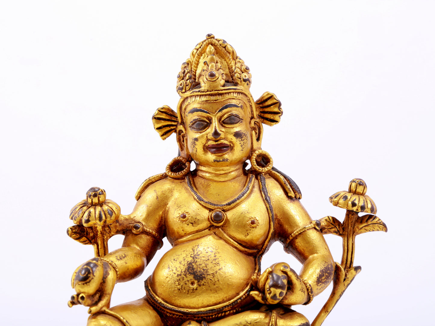 A solemn gilt bronze statue of the God of Wealth