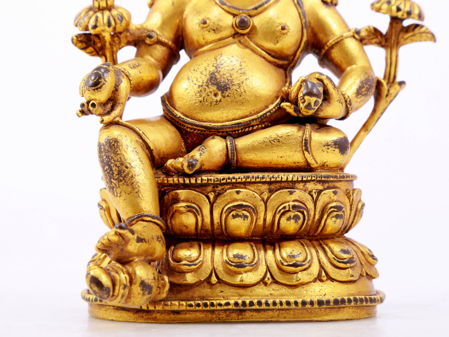 A solemn gilt bronze statue of the God of Wealth