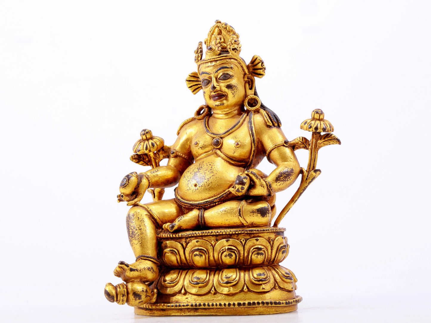 A solemn gilt bronze statue of the God of Wealth