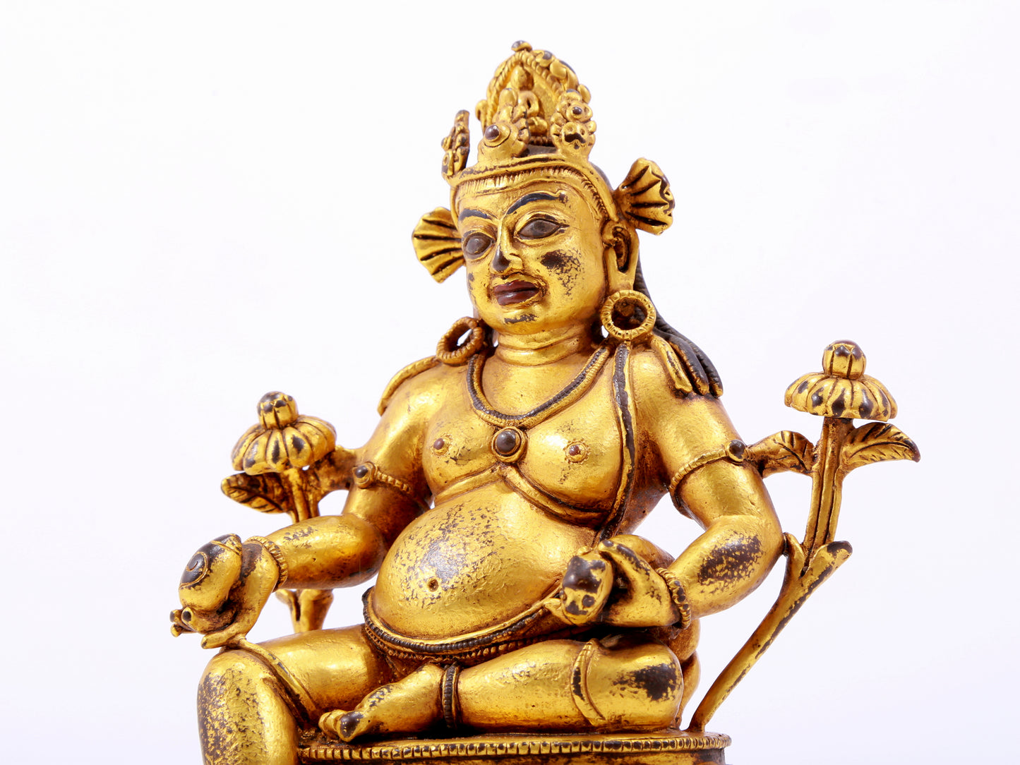 A solemn gilt bronze statue of the God of Wealth