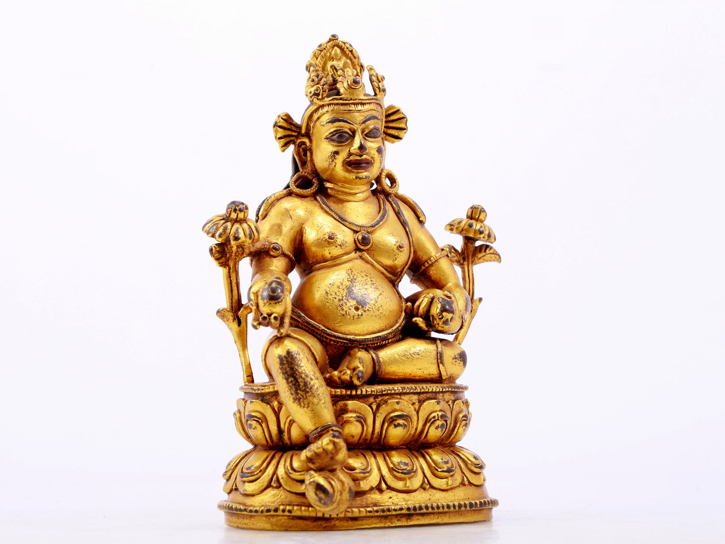 A solemn gilt bronze statue of the God of Wealth