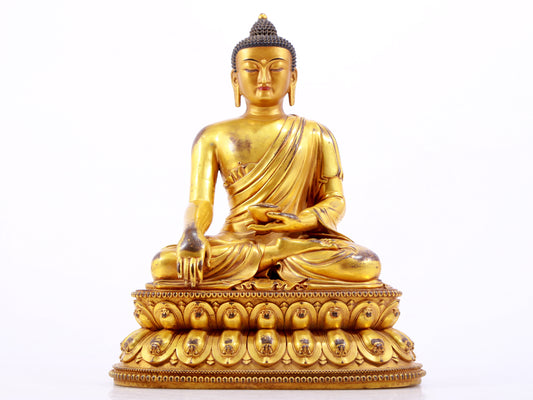 A majestic gilt bronze statue of Sakyamuni