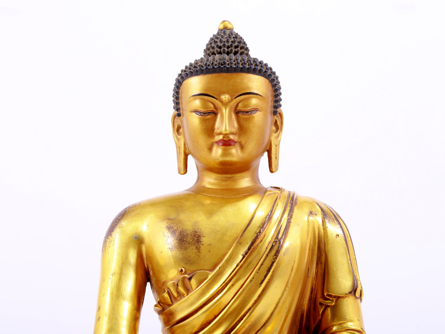 A majestic gilt bronze statue of Sakyamuni