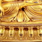 A majestic gilt bronze statue of Sakyamuni