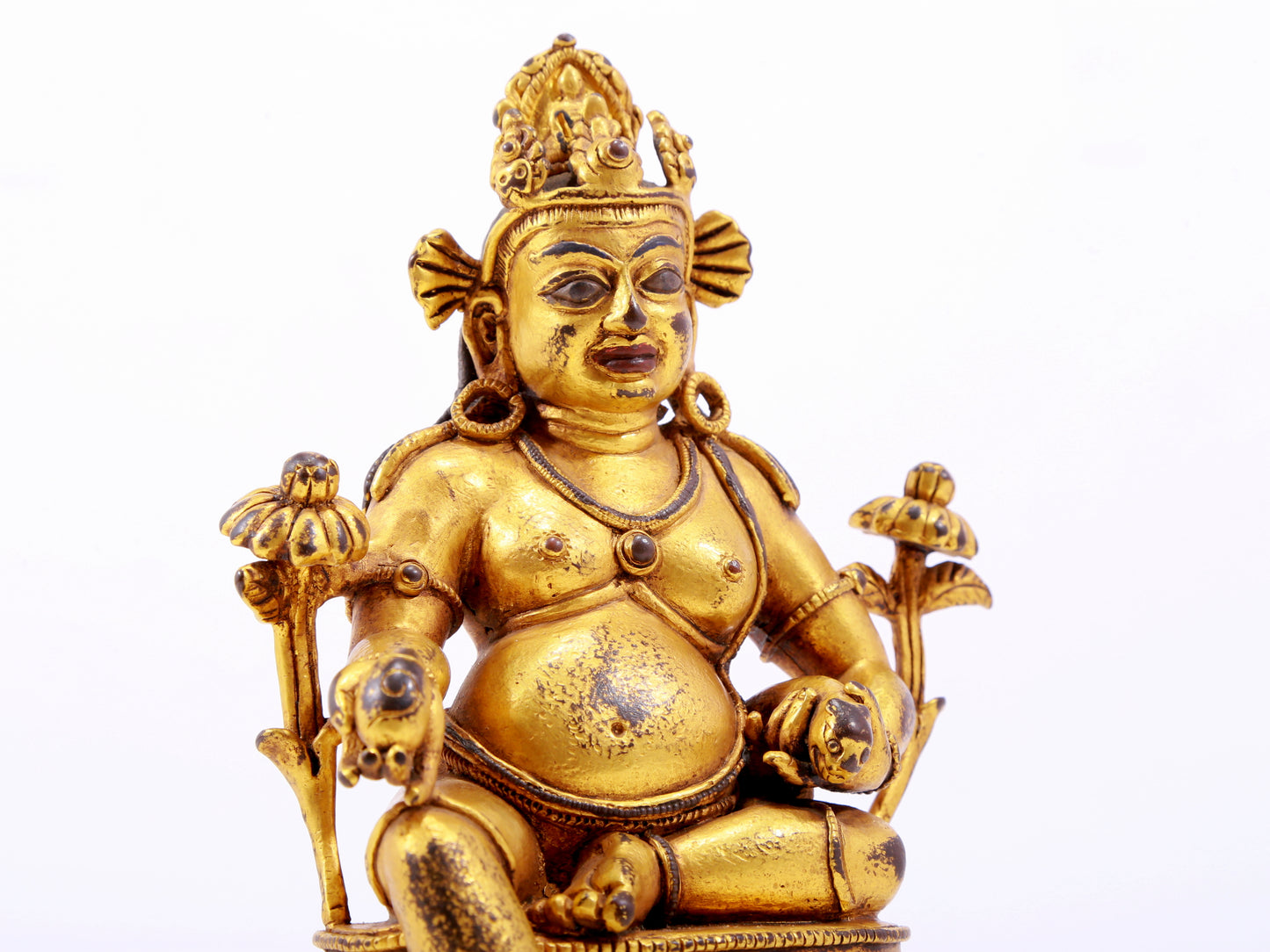 A solemn gilt bronze statue of the God of Wealth