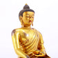 A majestic gilt bronze statue of Sakyamuni