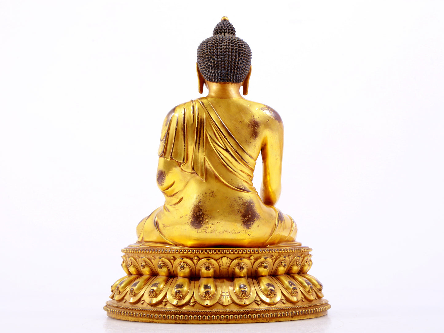 A majestic gilt bronze statue of Sakyamuni