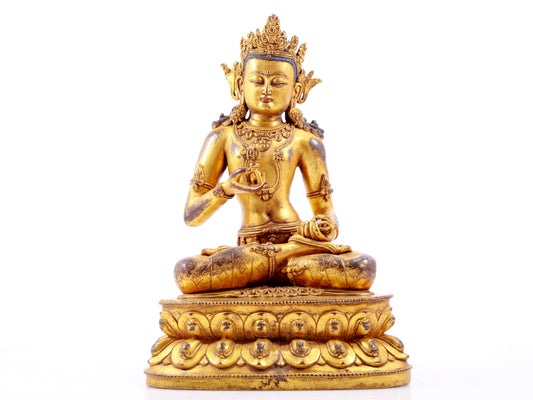 A solemn gilt bronze statue of Vajrasattva