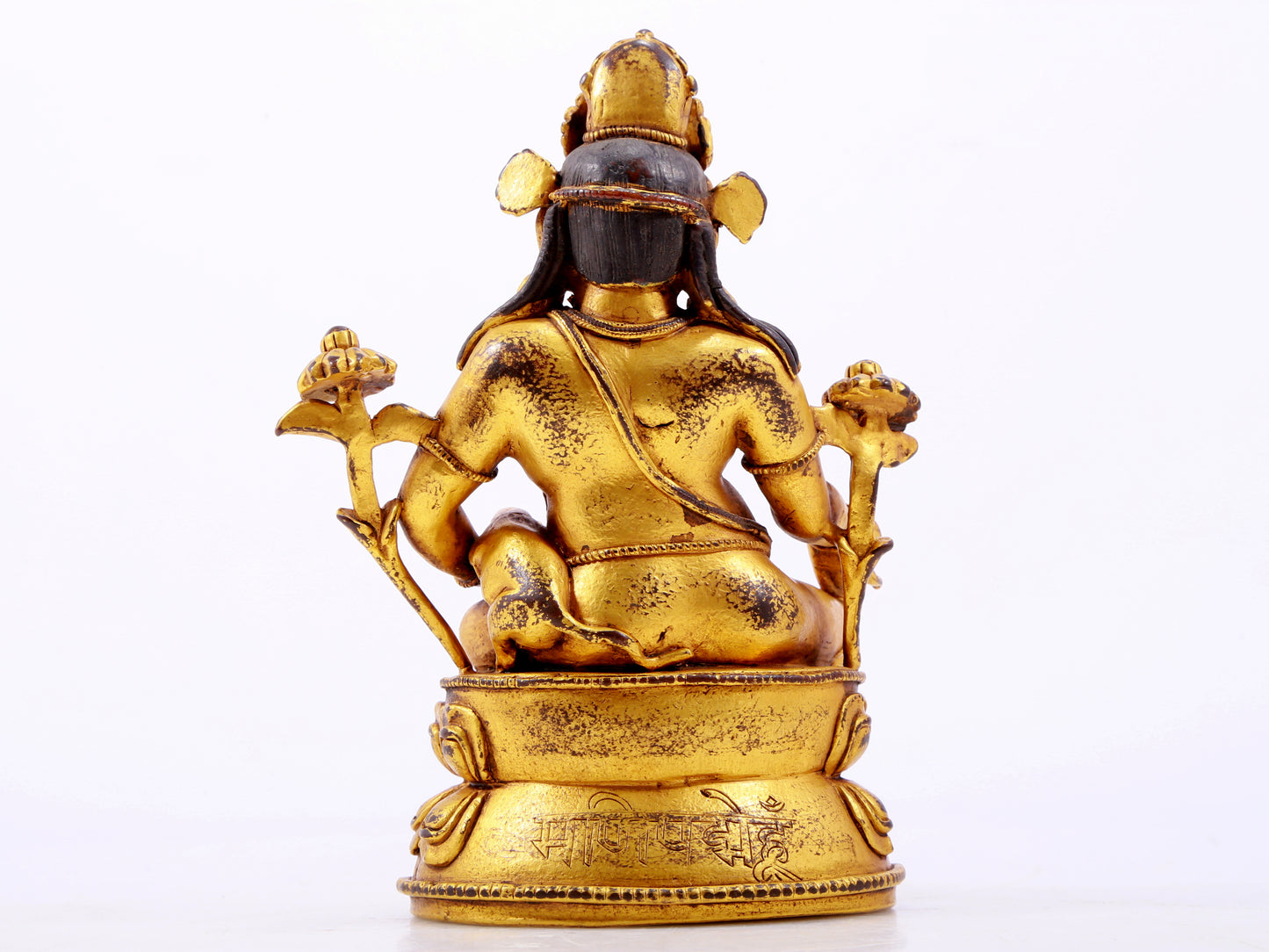 A solemn gilt bronze statue of the God of Wealth