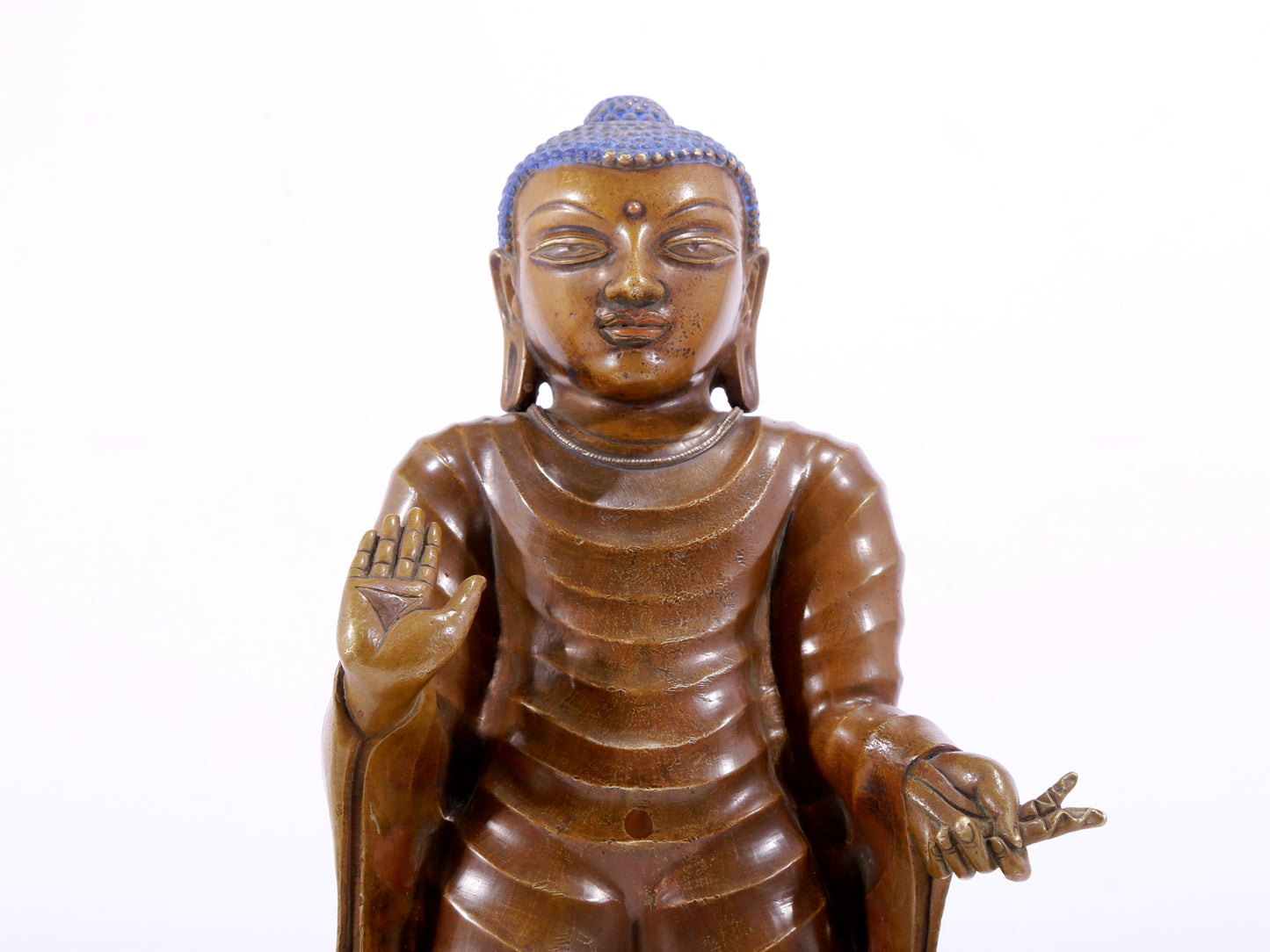 A solemn alloy copper statue of Gautama Buddha