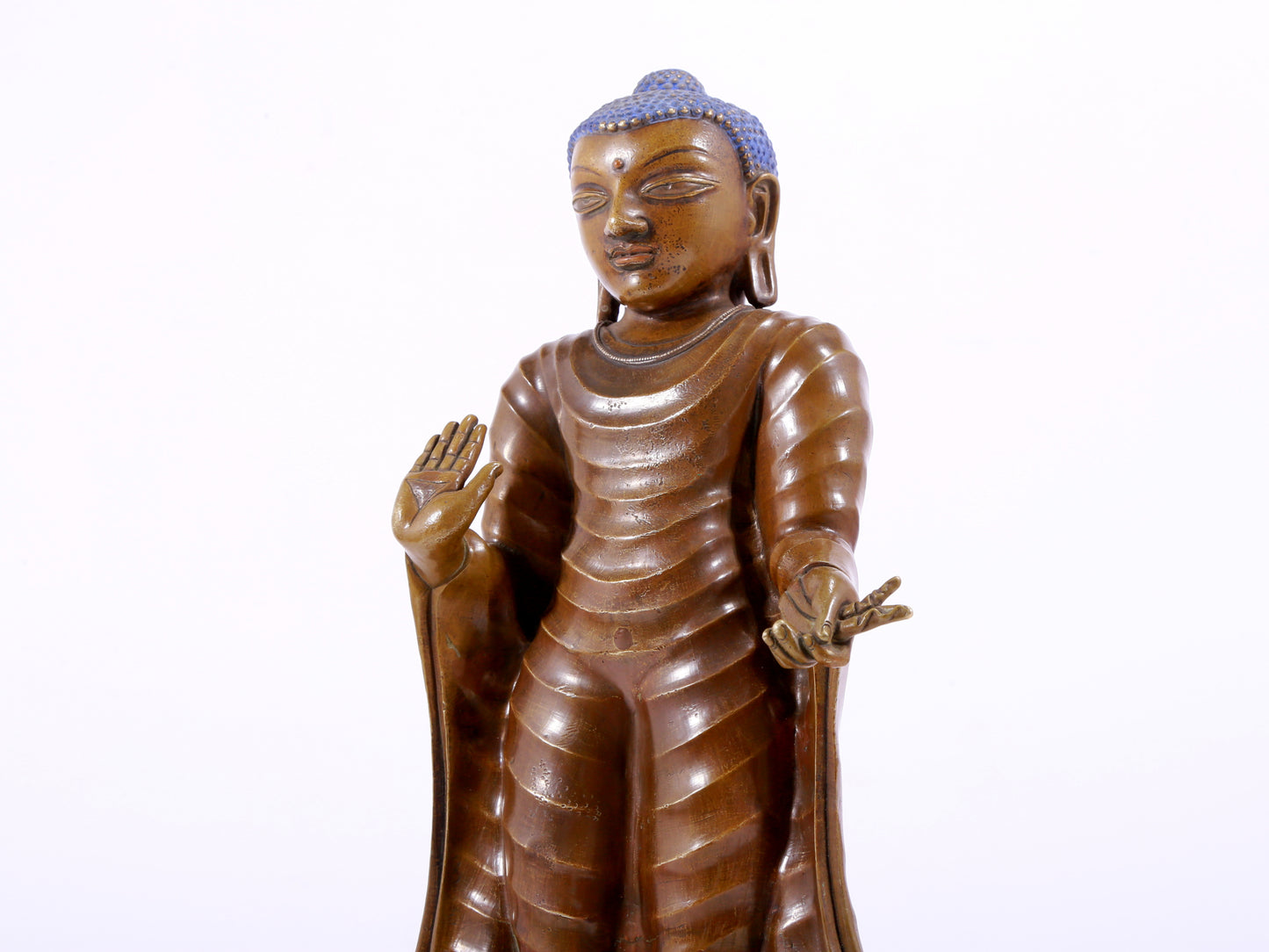 A solemn alloy copper statue of Gautama Buddha