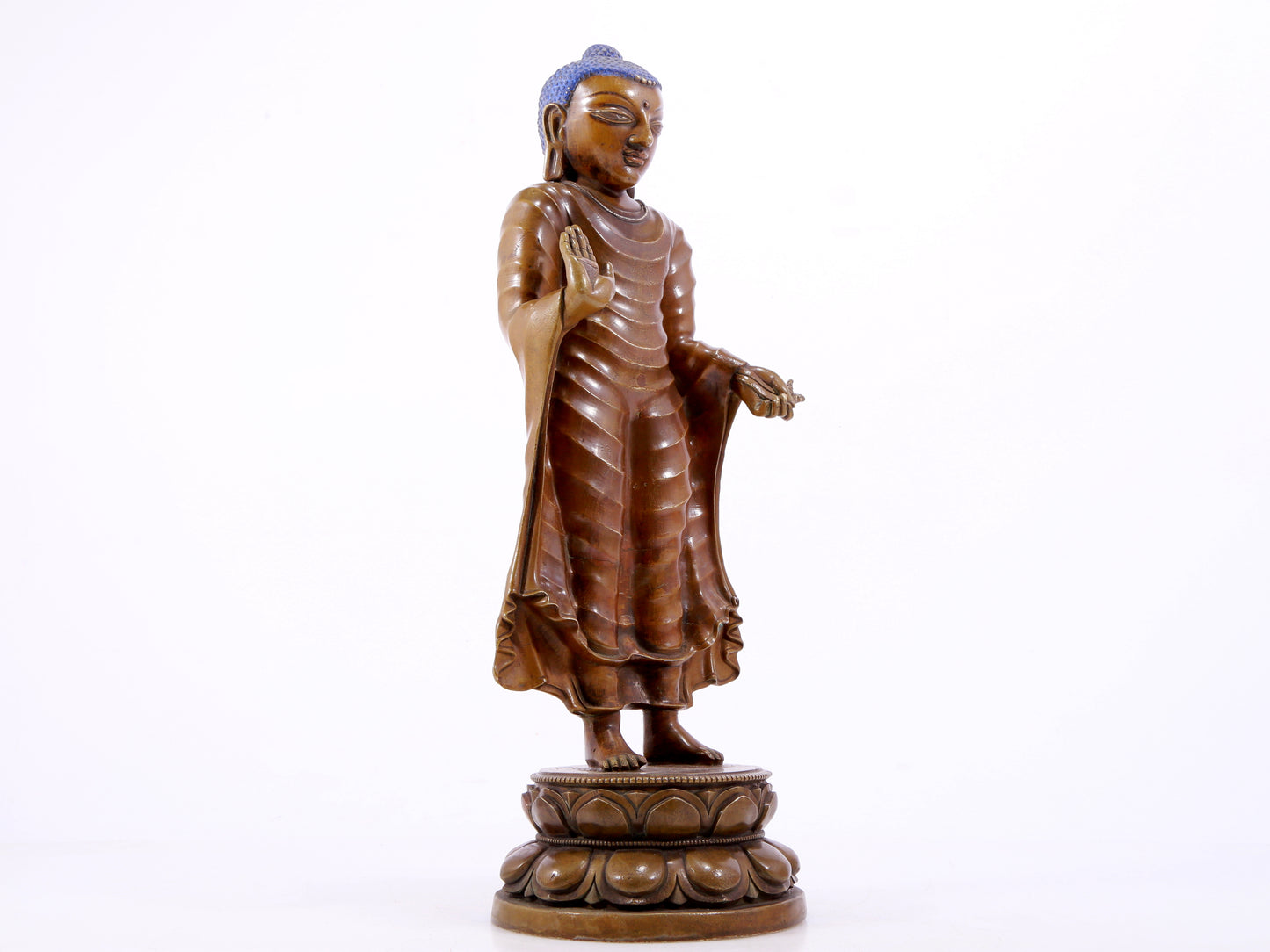 A solemn alloy copper statue of Gautama Buddha