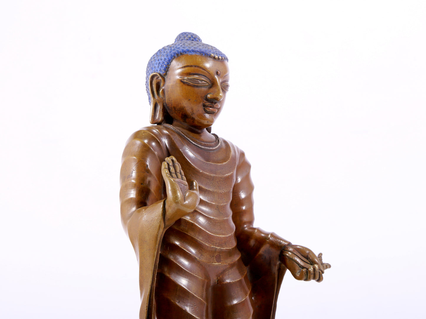 A solemn alloy copper statue of Gautama Buddha