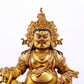 A solemn gilt bronze statue of the God of Wealth