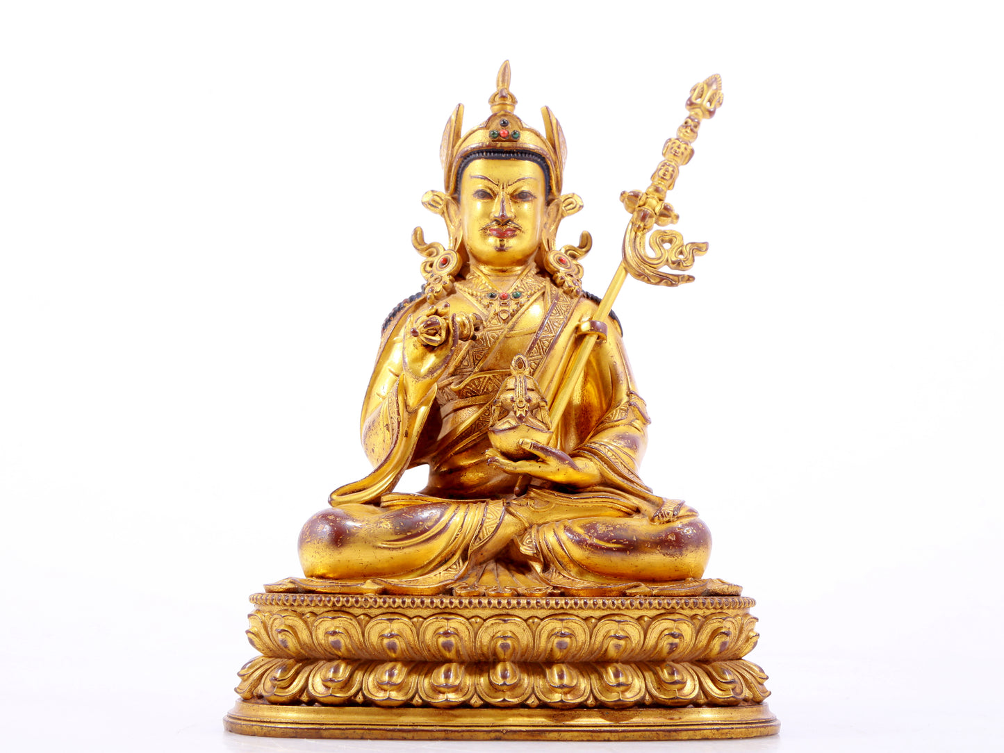 A solemn gilt bronze statue of Padmasambhava