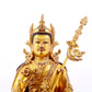 A solemn gilt bronze statue of Padmasambhava