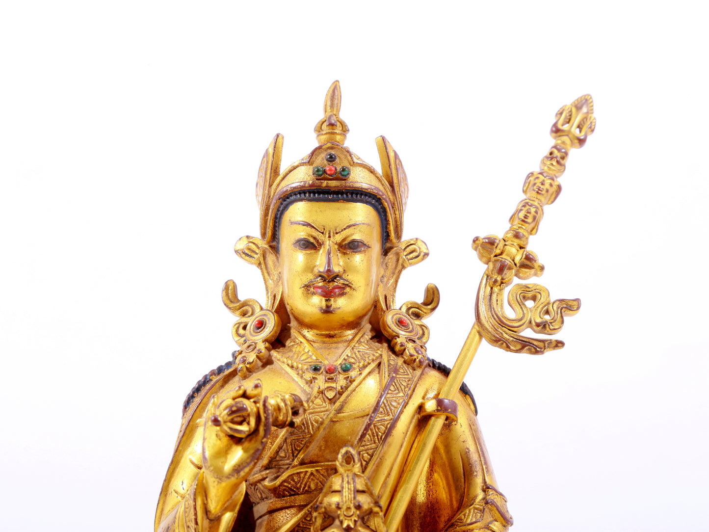 A solemn gilt bronze statue of Padmasambhava