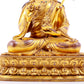 A solemn gilt bronze statue of Padmasambhava