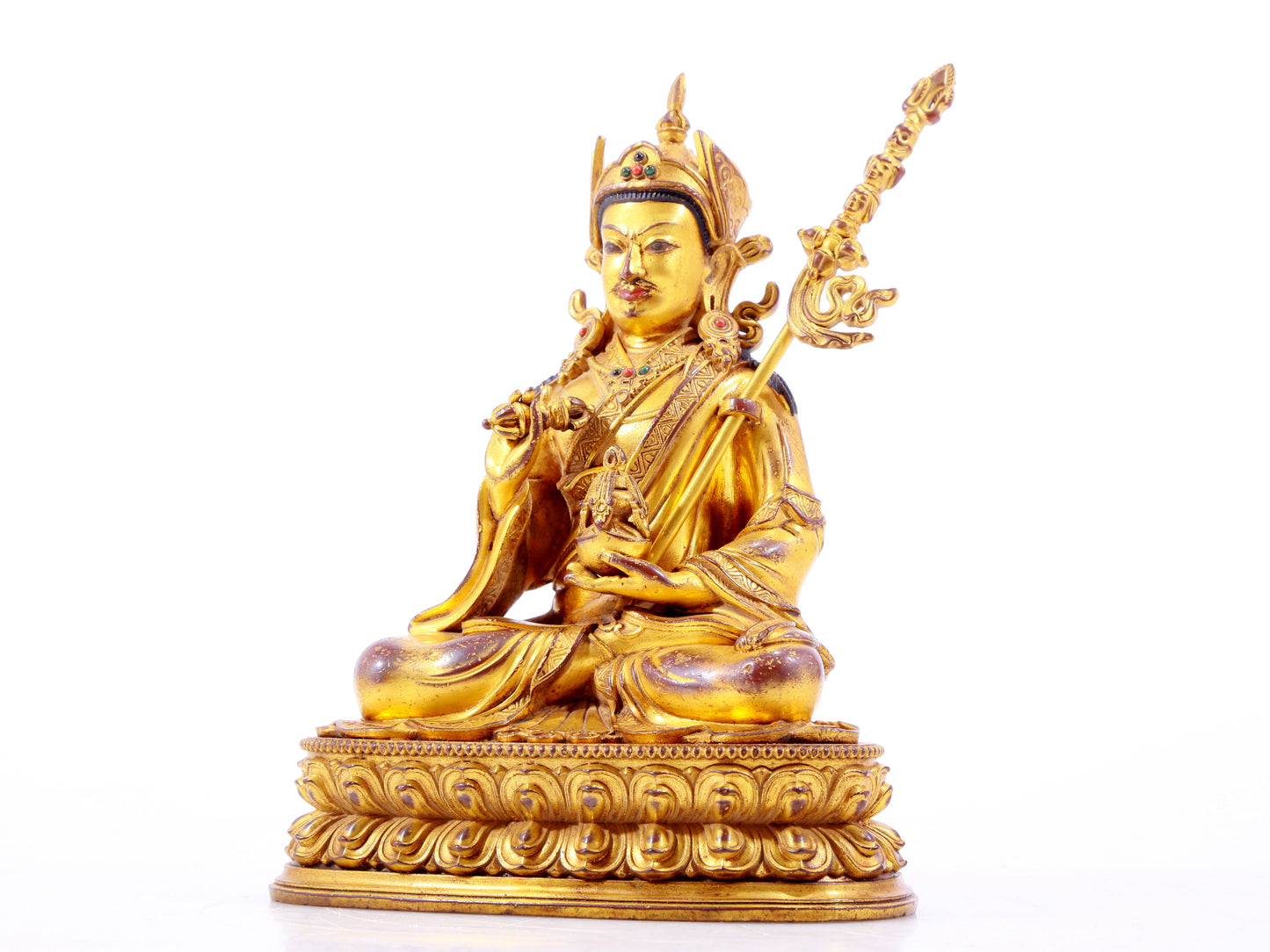 A solemn gilt bronze statue of Padmasambhava