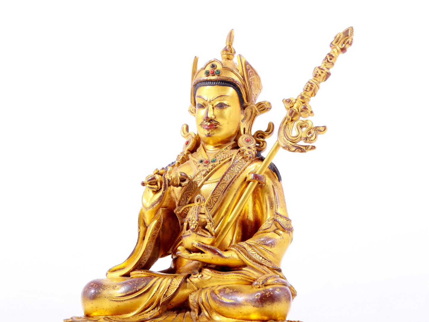 A solemn gilt bronze statue of Padmasambhava