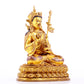 A solemn gilt bronze statue of Padmasambhava