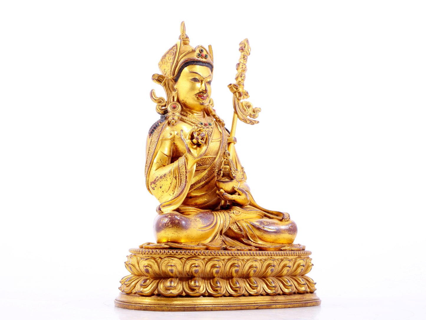 A solemn gilt bronze statue of Padmasambhava