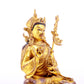 A solemn gilt bronze statue of Padmasambhava