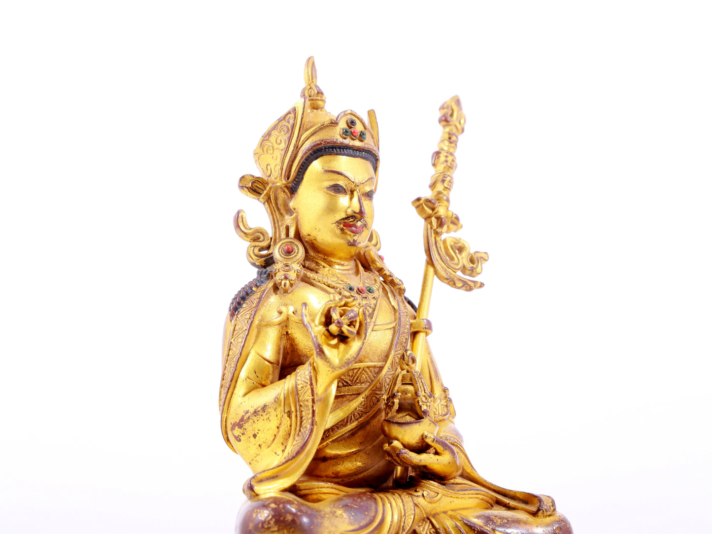 A solemn gilt bronze statue of Padmasambhava