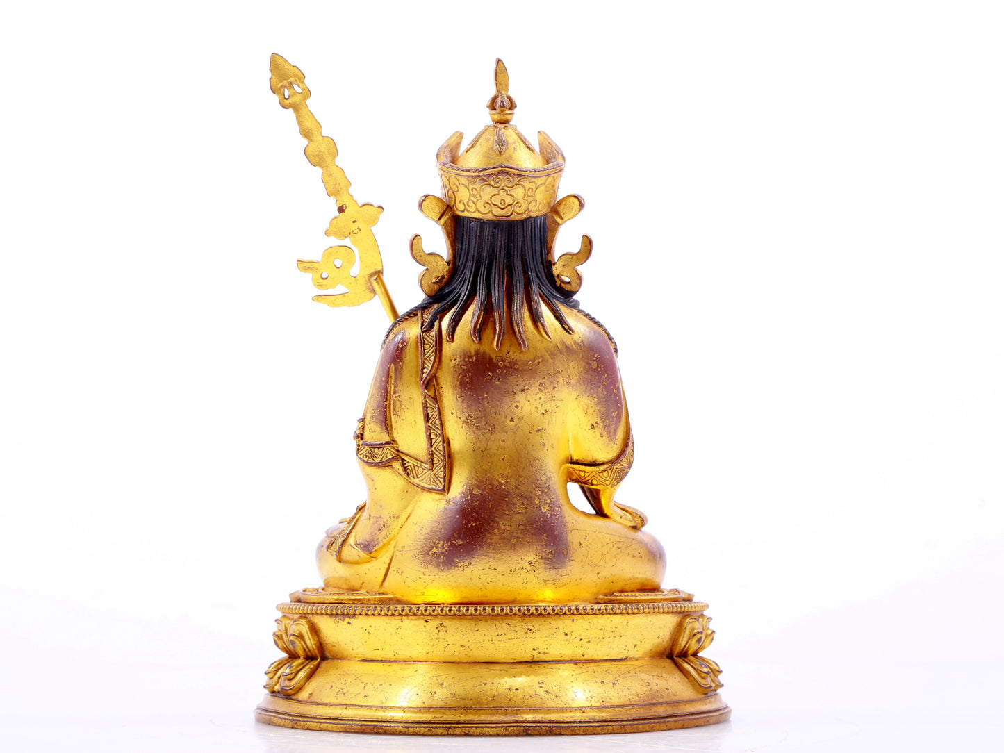 A solemn gilt bronze statue of Padmasambhava