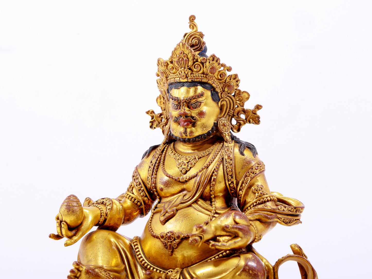 A solemn gilt bronze statue of the God of Wealth