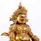 A solemn gilt bronze statue of the God of Wealth