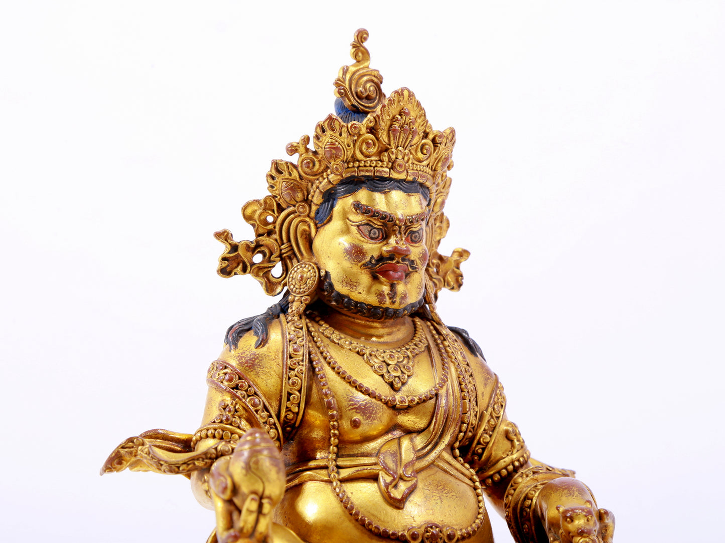 A solemn gilt bronze statue of the God of Wealth