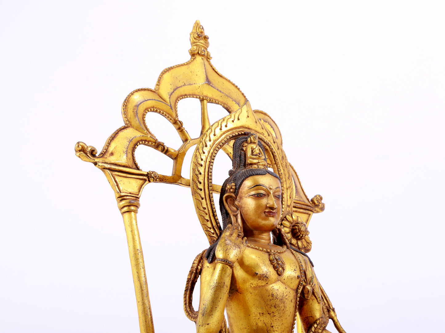 A majestic gilt bronze statue of green Tara