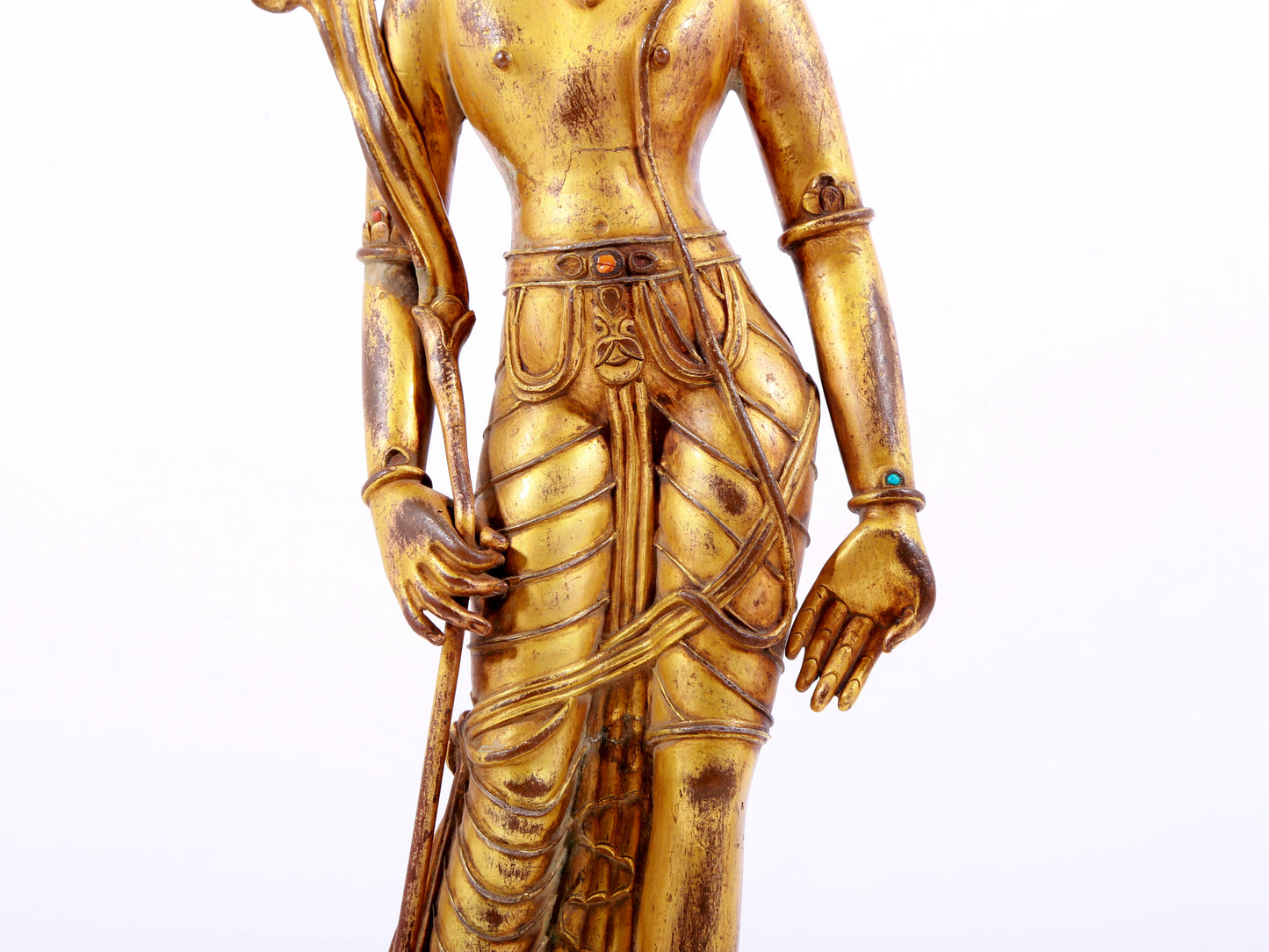 A solemn gilt bronze statue of Tara inlaid with hundreds of treasures