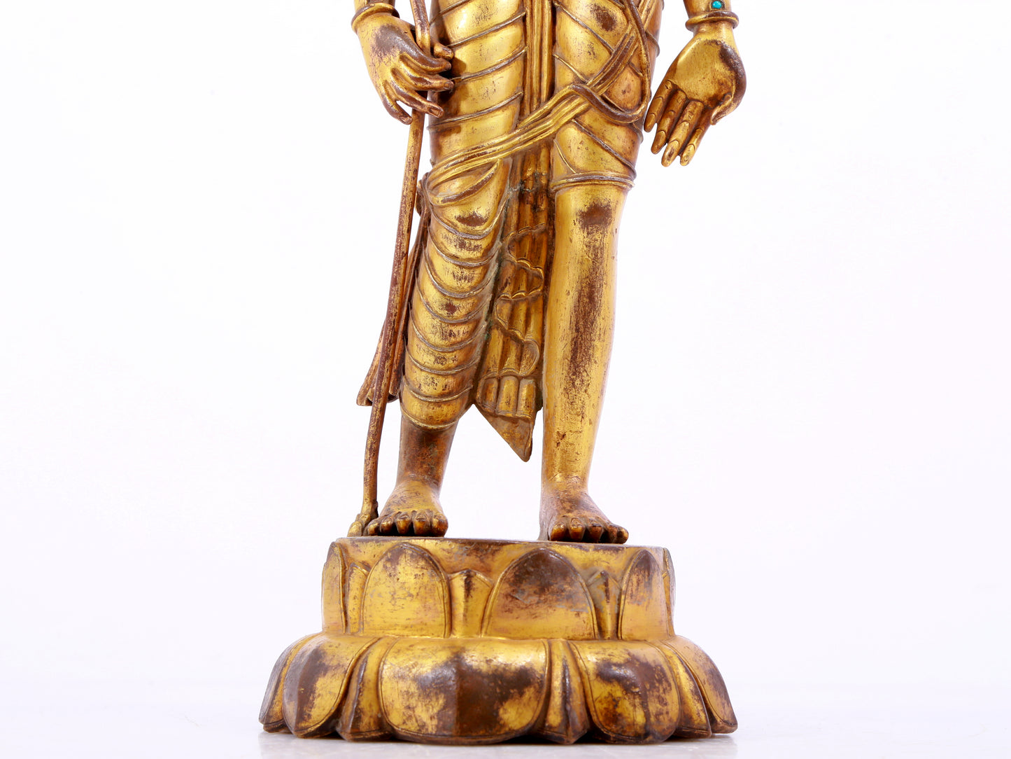 A solemn gilt bronze statue of Tara inlaid with hundreds of treasures