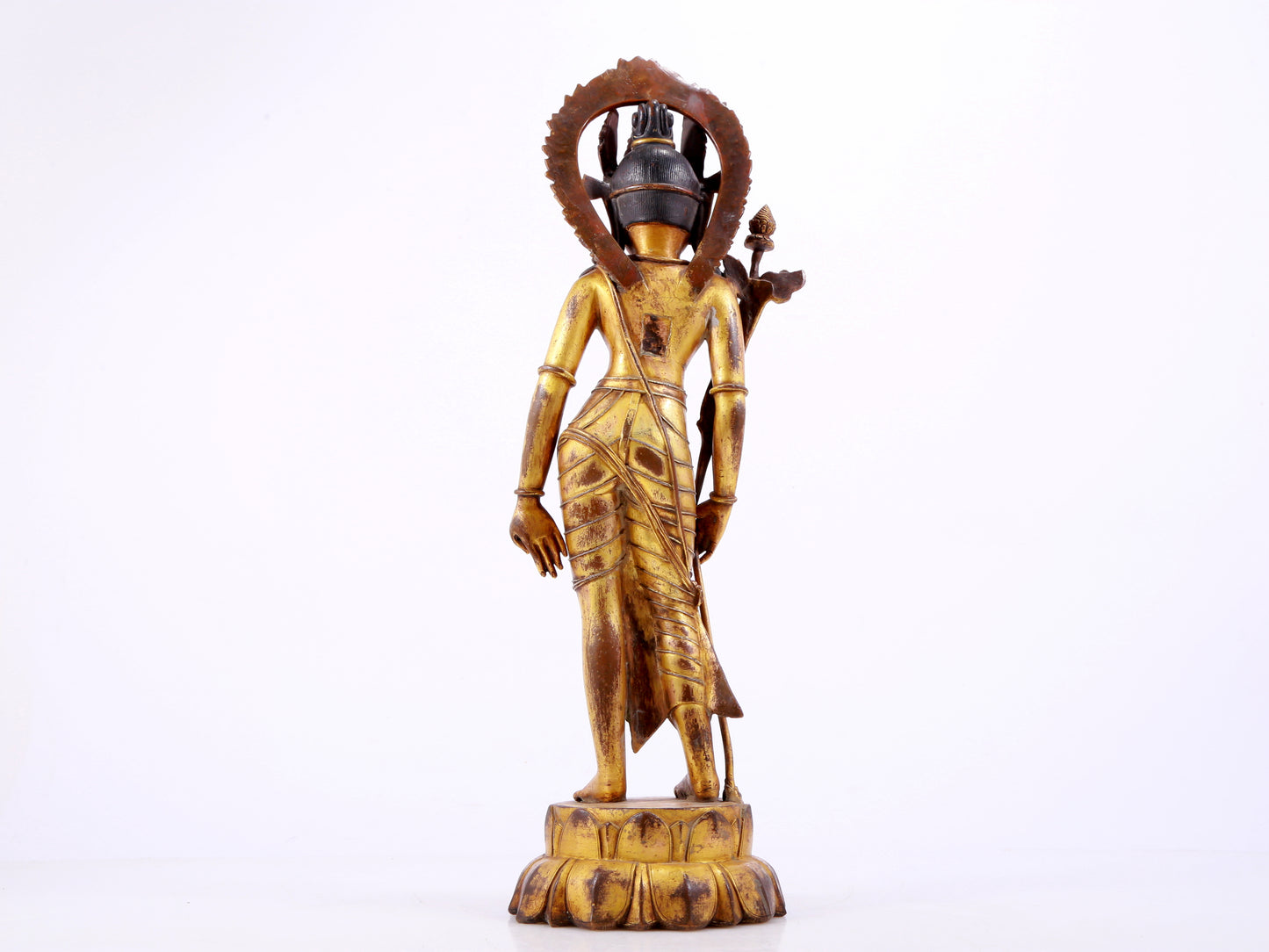 A solemn gilt bronze statue of Tara inlaid with hundreds of treasures