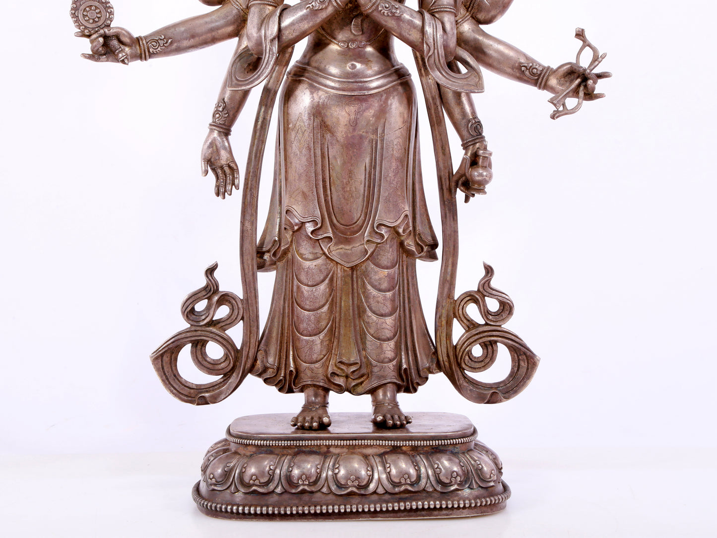 A majestic gilt bronze and silver statue of Avalokitesvara with Thousand Arms