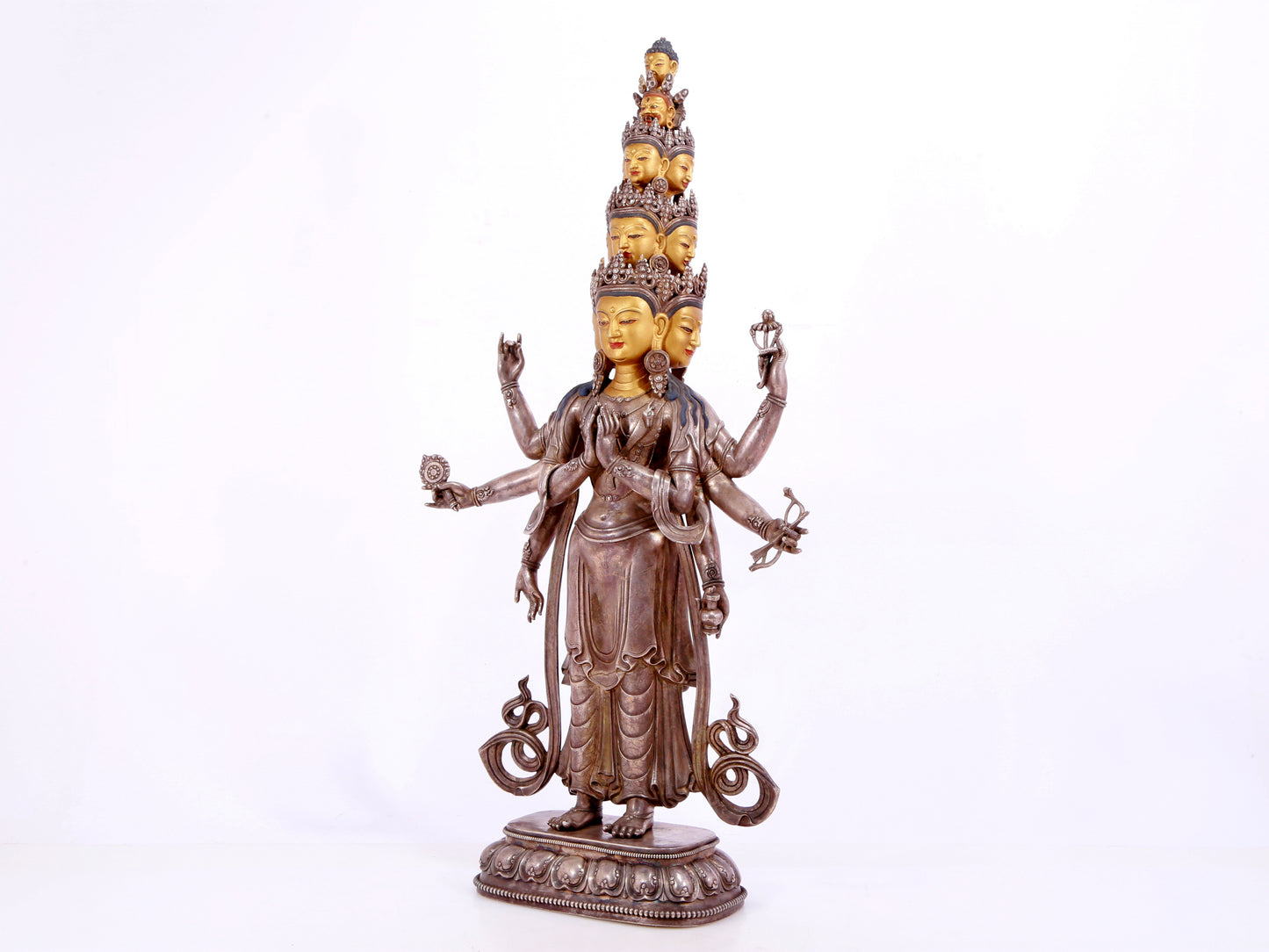 A majestic gilt bronze and silver statue of Avalokitesvara with Thousand Arms