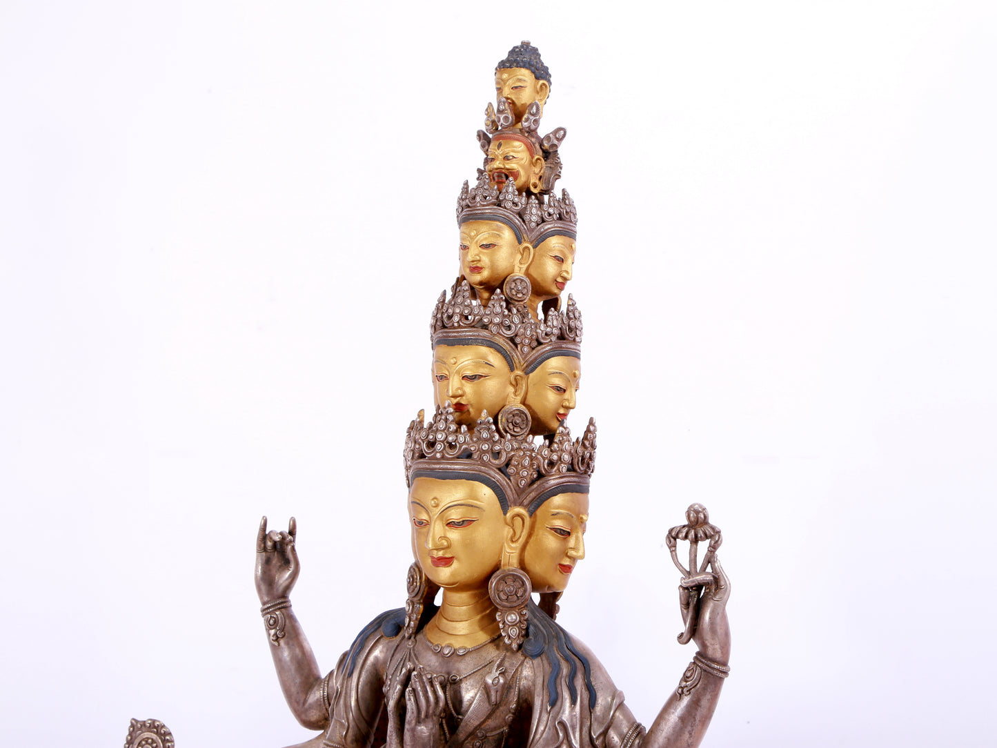 A majestic gilt bronze and silver statue of Avalokitesvara with Thousand Arms