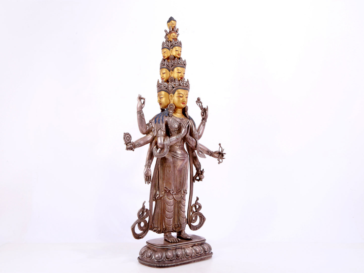 A majestic gilt bronze and silver statue of Avalokitesvara with Thousand Arms