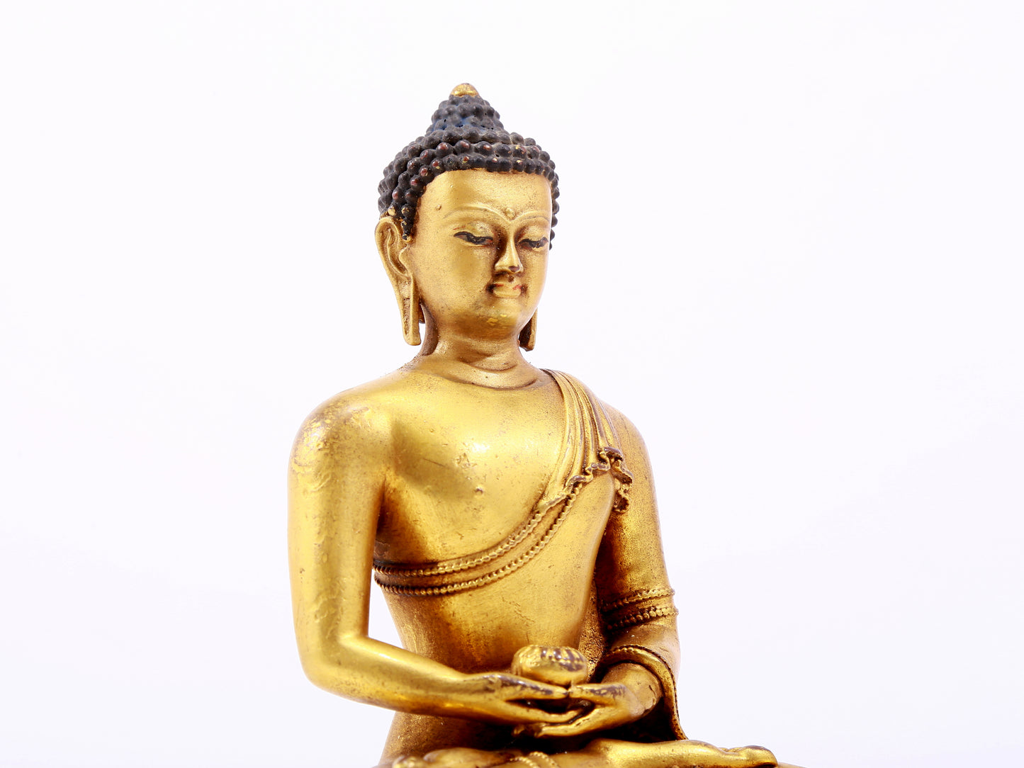 A majestic gilt bronze statue of Sakyamuni