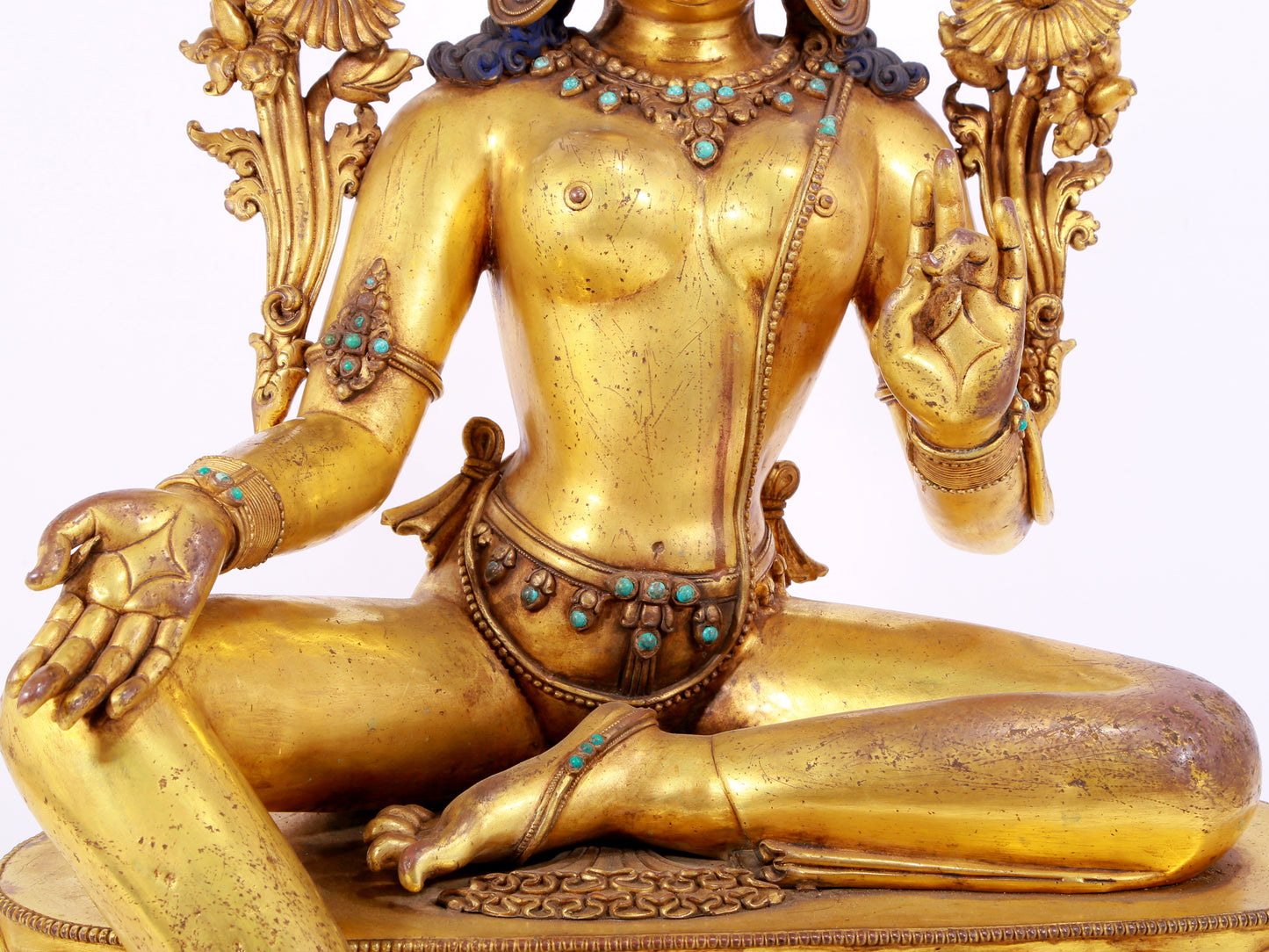 A solemn gilt copper inlaid turquoise green Tara statue