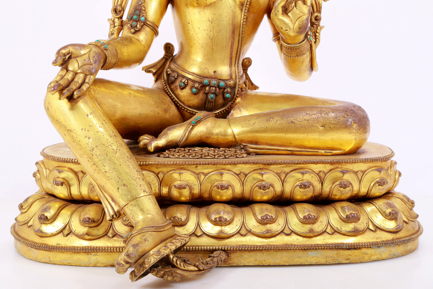 A solemn gilt copper inlaid turquoise green Tara statue