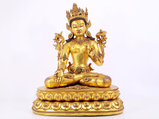 majestic gilt bronze statue of White Tara inlaid with turquoise