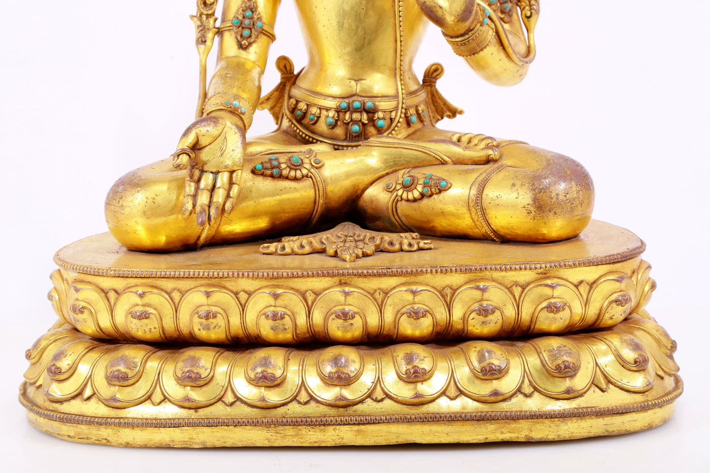 majestic gilt bronze statue of White Tara inlaid with turquoise