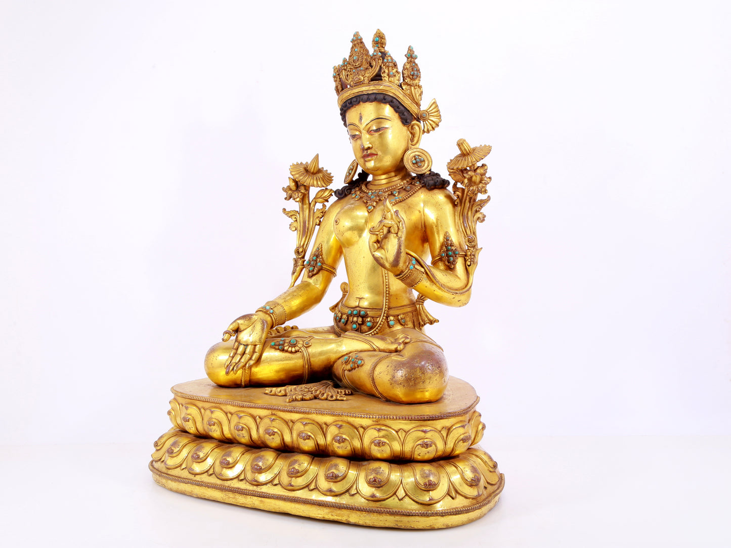 majestic gilt bronze statue of White Tara inlaid with turquoise