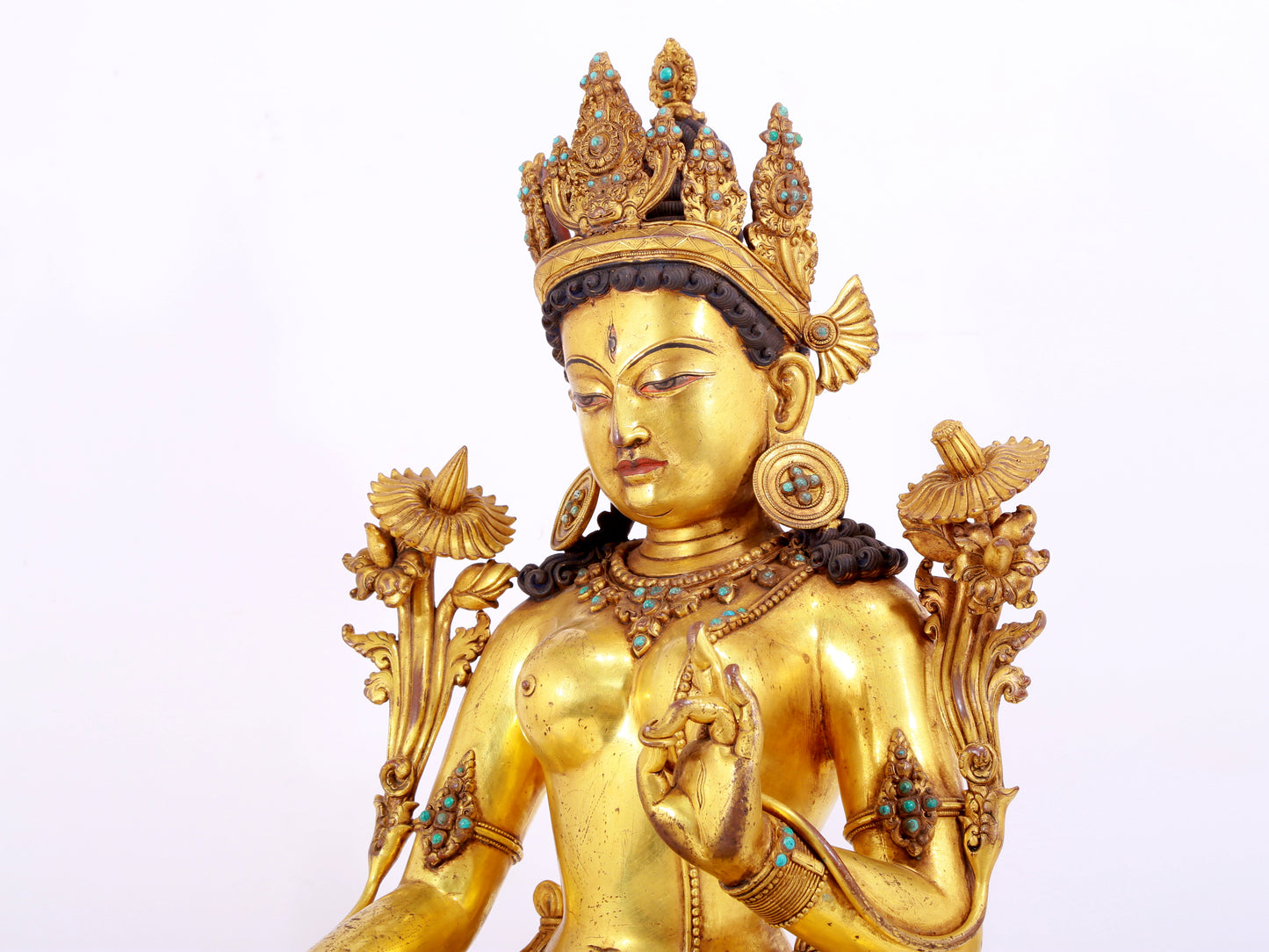 majestic gilt bronze statue of White Tara inlaid with turquoise