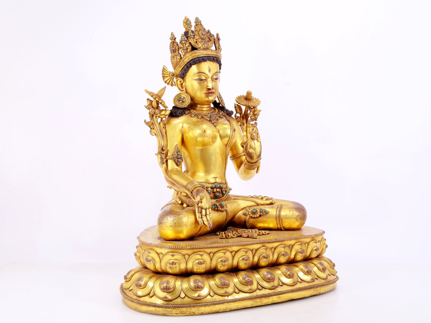 majestic gilt bronze statue of White Tara inlaid with turquoise