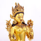 majestic gilt bronze statue of White Tara inlaid with turquoise